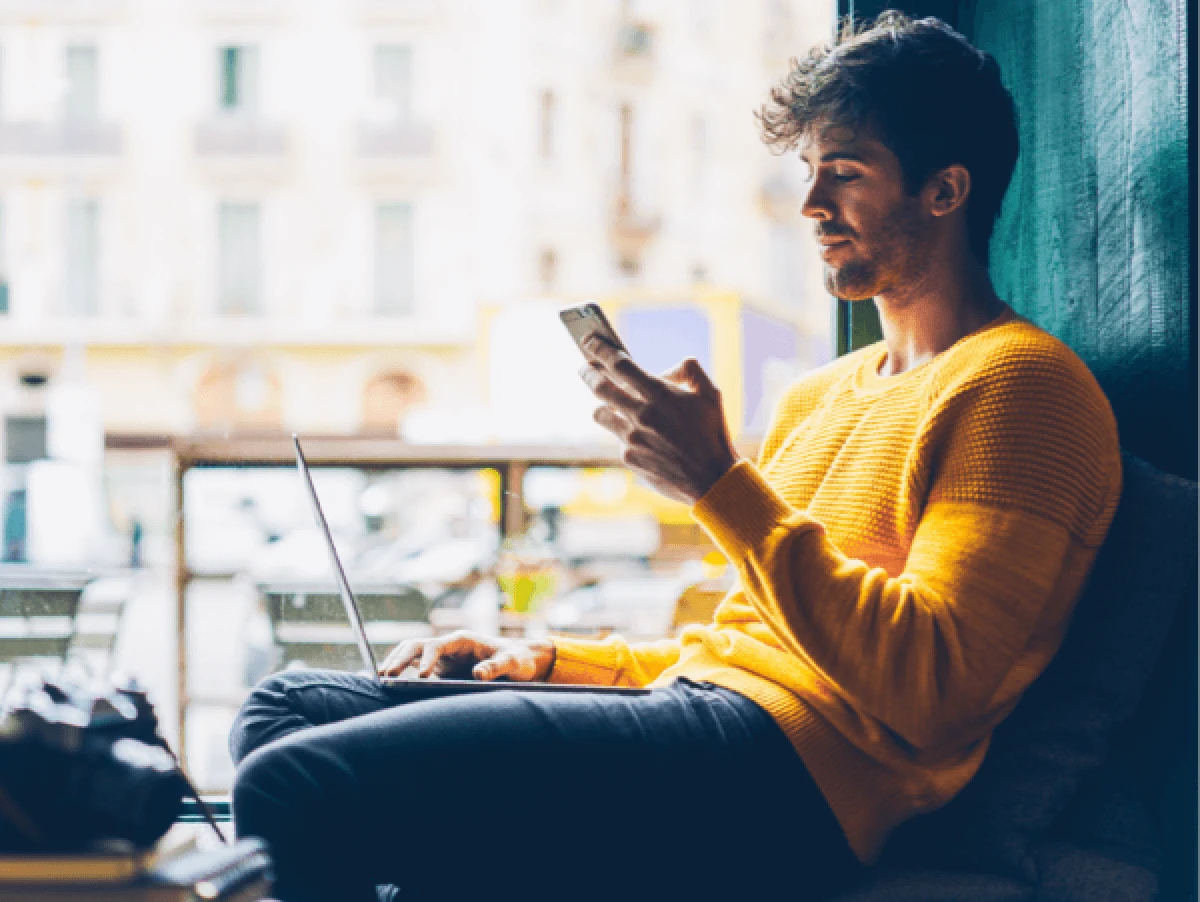 Man using phone on public Wi-Fi